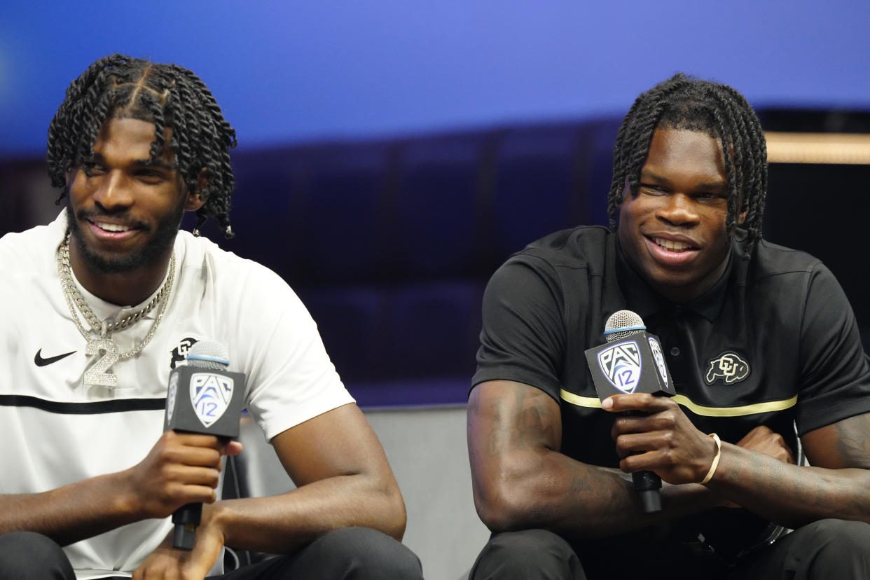 LAS VEGAS, NEVADA - JULY 21: (L-R) Shedeur Sanders #2 and Travis Hunter #12 of the University of Colorado Buffaloes speak with the media at Zouk Nightclub at Resorts World Las Vegas on July 21, 2023 in Las Vegas, Nevada. (Photo by Louis Grasse/Getty Images)