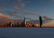 <p>The skyline of lower Manhattan is shown at sunset from Hoboken, N.J., as a winter storm retreats from the area, Feb. 9, 2017. A powerful, fast-moving storm swept through the northeastern U.S. Thursday, making for a slippery morning commute and leaving some residents bracing for blizzard conditions. (Photo: Gary Hershorn/Getty Images) </p>