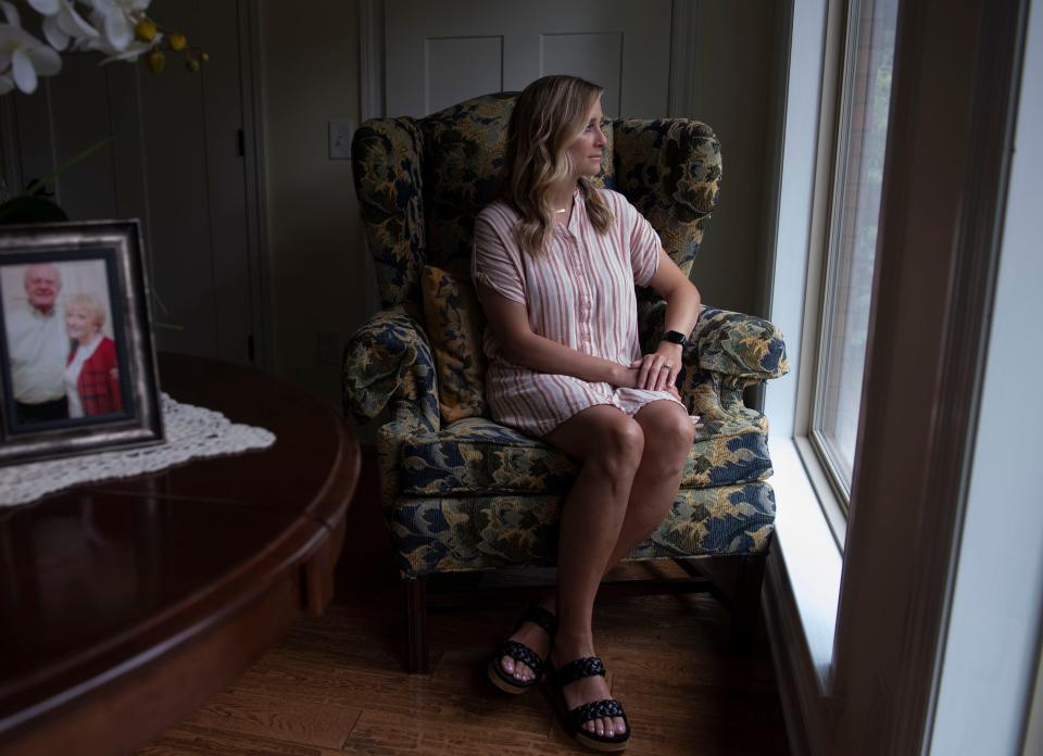 Ashley Helton Rutledge sits in the room where she would spend time with her grandparents Bill and Donna Helton, at Bill Helton's home in Lawrenceburg, Tenn., Friday, July 14, 2023.