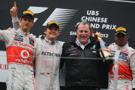 SHANGHAI, CHINA - APRIL 15: Race winner Nico Rosberg (2nd left) of Germany and Mercedes GP celebrates with second placed Jenson Button (left) of Great Britain and McLaren, third placed Lewis Hamilton (right) of Great Britain and McLaren and Norbert Haug (2nd right) of Mercedes Motorsport on the podium following the Chinese Formula One Grand Prix at the Shanghai International Circuit on April 15, 2012 in Shanghai, China. (Photo by Mark Thompson/Getty Images)