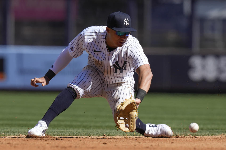 New York Yankees shortstop Anthony Volpe fields a ball during the sixth inning of a baseball game against the San Francisco Giants at Yankee Stadium Thursday, March 30, 2023, in New York. (AP Photo/Seth Wenig)