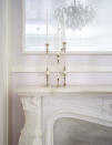 A look at one of the apartment's details. A white fireplace with white mantle on white walls. <i>(Photo: Goop.com)</i>