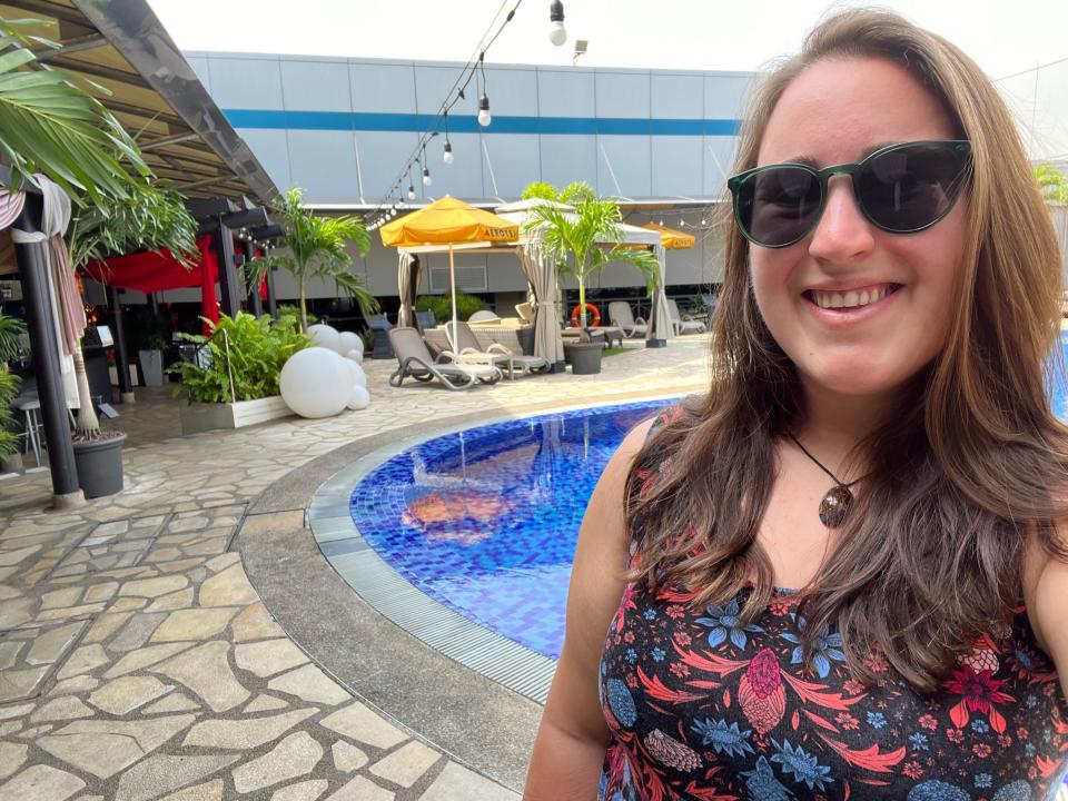 A selfie of the author with the pool in the background.