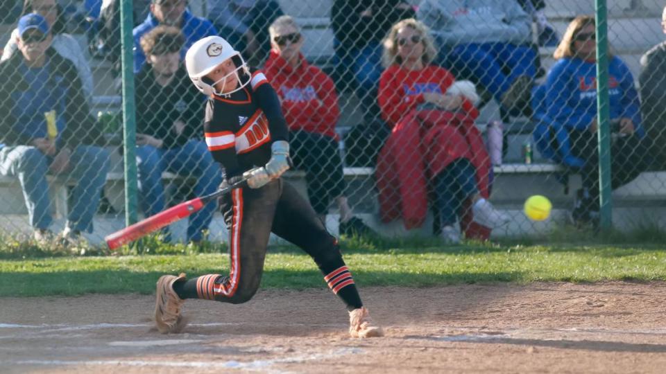 Frederick Douglass freshman Emma Dunn sized up a pitch that she knocked over the fence for a solo home run against Lafayette at Lafayette High School on Monday, Jan. 22, 2024. Jared Peck/jpeck@herald-leader.com