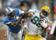 DETROIT, MI - NOVEMBER 24: Jermichael Finley #88 of the Green Bay Packers catches a pass for a first down as Chris Harris #43 of the Green Bay Packers atempts to make the tackle during the third quarter of the game at Ford Field on November 24, 2011 in Detroit, Michigan. The Packers defeated the Lions 27-15. (Photo by Leon Halip/Getty Images)