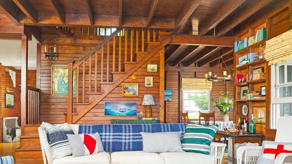 wood paneling covers the walls in a maine cabin living room