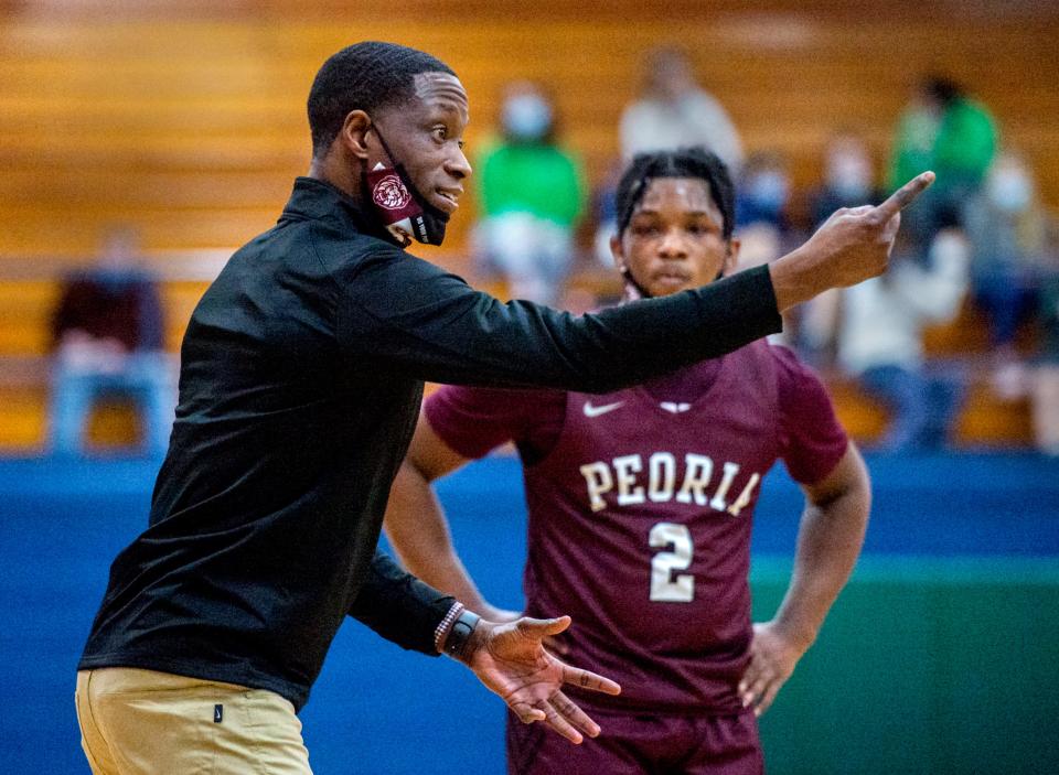 Peoria High head coach Daniel Ruffin directs his team against Peoria Notre Dame in last season's game.