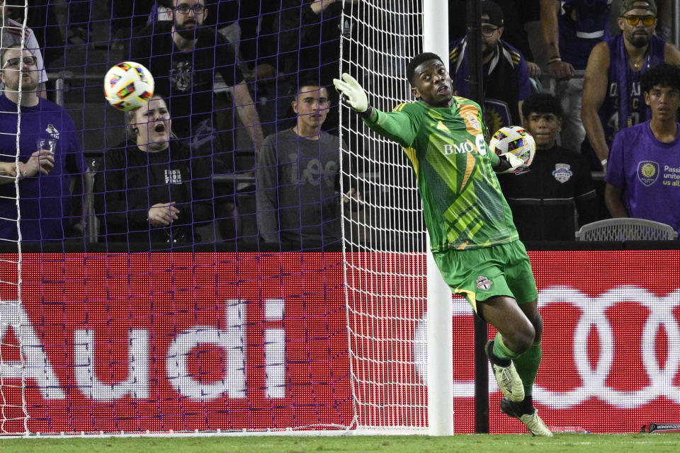 Toronto FC goalkeeper Sean Johnson defends against a shot by Orlando City that missed the net during the first half of an MLS soccer match Saturday, April 27, 2024, in Orlando, Fla. (AP Photo/Phelan M. Ebenhack)