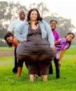 Plus-size model and part-time carer Mikel Ruffinelli, who weighs 420 lbs. and whose hips measure more than eight feet in circumference, set the new world record for World's Largest Hips. With husband Reggie and daughters (l-r) Autumn, Destynee and Justyce. (Photo courtesy of <span> World Record Academy.</span>