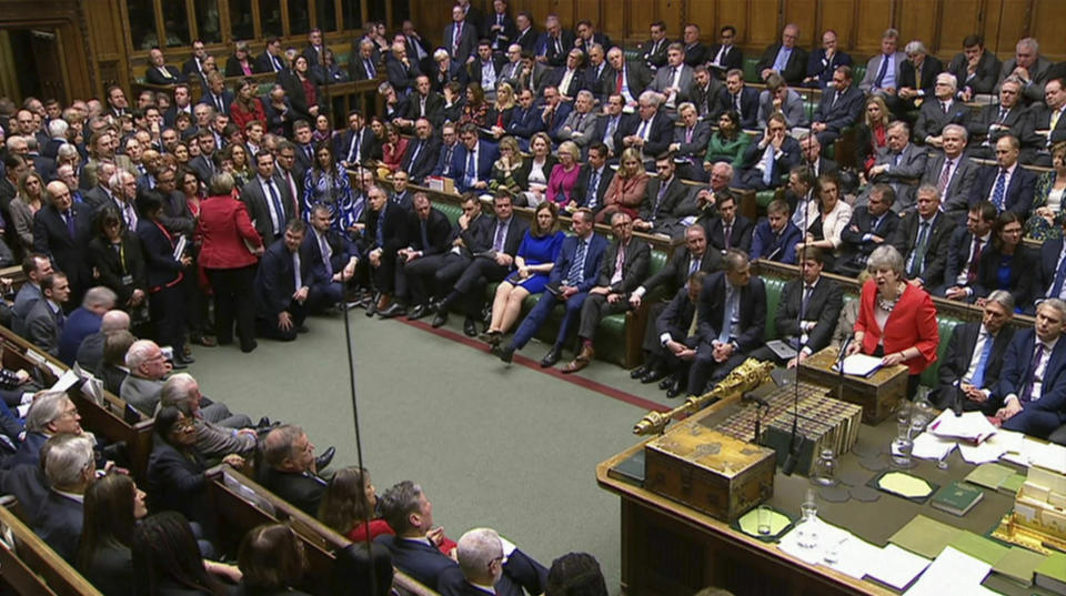 In this image taken from video, Britain's Prime Minister Theresa May speaks to lawmakers in parliament, London, Tuesday March 12, 2019. Britain’s Parliament delivered a crushing defeat to Prime Minister Theresa May’s European Union divorce deal Tuesday, plunging the Brexit process into chaos just 17 days before the U.K. is due to leave the bloc. (House of Commons/PA via AP)