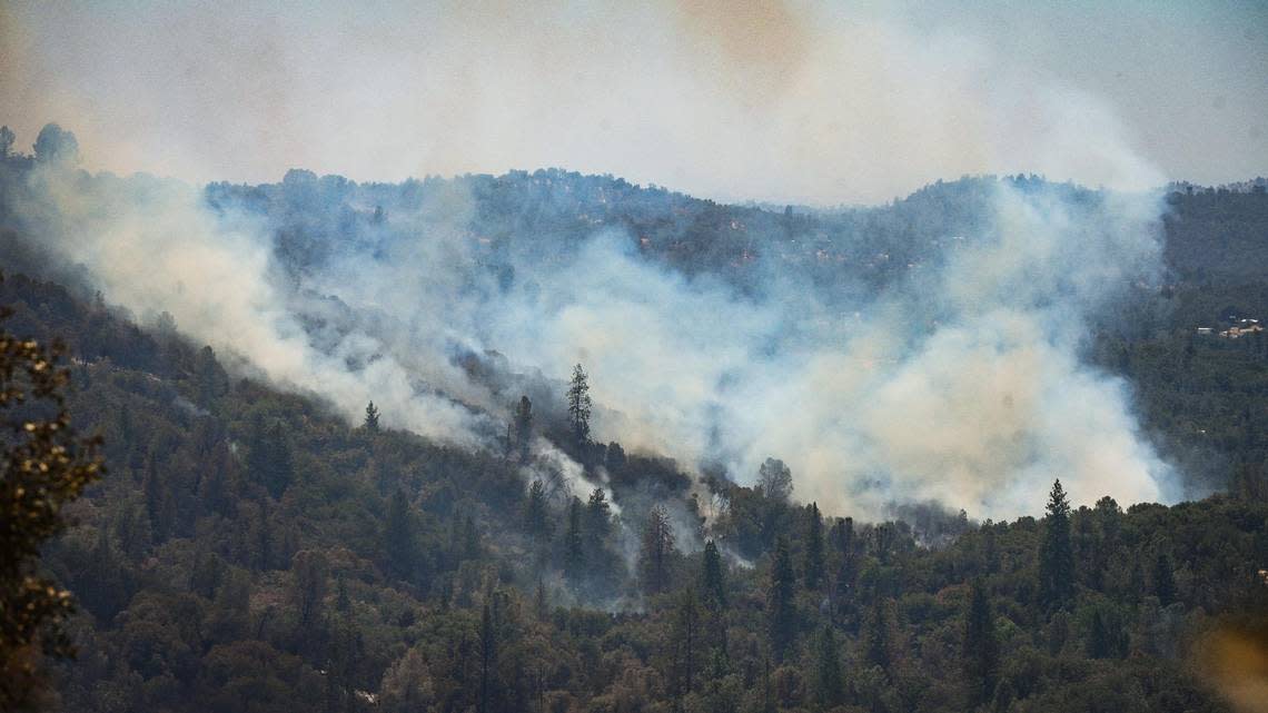Smoke billows from the Oak Fire in a canyon near Darrah Road south of Triangle Road in Mariposa County on Monday, July 25, 2022.