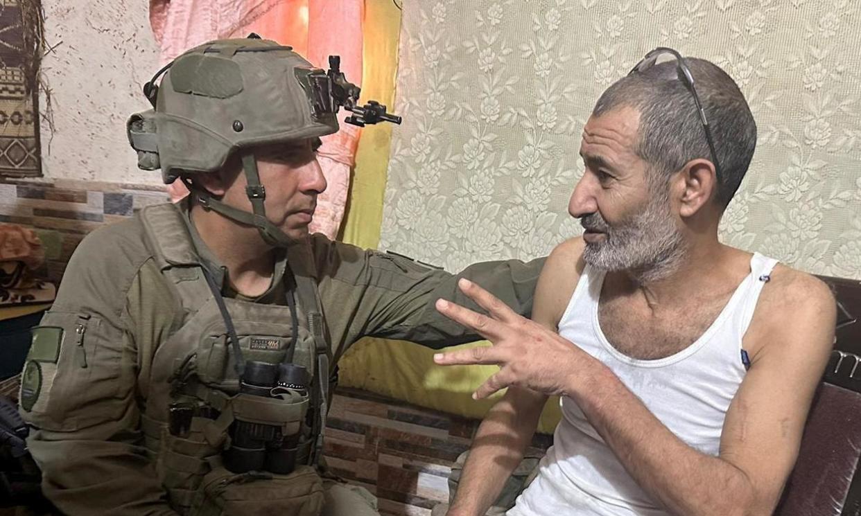 <span>Qaid Farhan Alkadi (right), a Bedouin Israeli, was kidnapped during the 7 October attack by Hamas.</span><span>Photograph: Israel Defense Forces/Reuters</span>