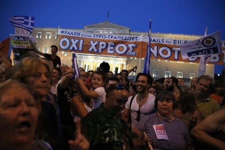 Protesters shout slogans in front of the parliament building during an anti-austerity rally in Athens, Greece, June 29, 2015. REUTERS/Alkis Konstantinidis