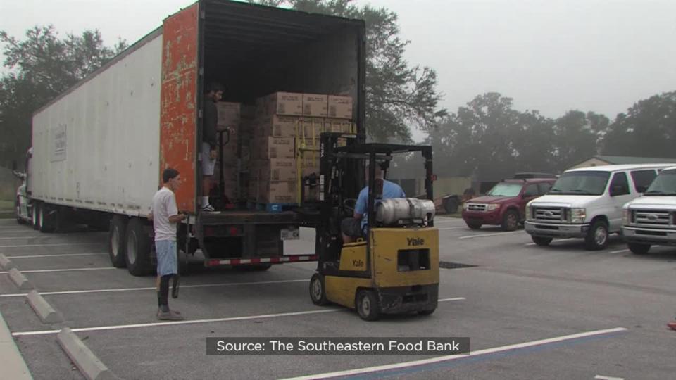 Nearly 100 members of the church started the day unloading truckloads of food in the church parking lot and loading it into vehicles for delivery.