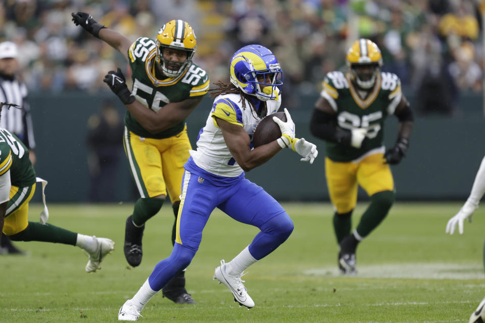 Los Angeles Rams wide receiver Demarcus Robinson (15) runs with the football during the second half of an NFL football game against the Green Bay Packers, Sunday, Nov. 5, 2023, in Green Bay, Wis. (AP Photo/Matt Ludtke)