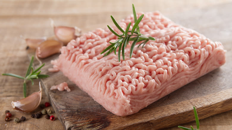 Ground turkey on wooden board