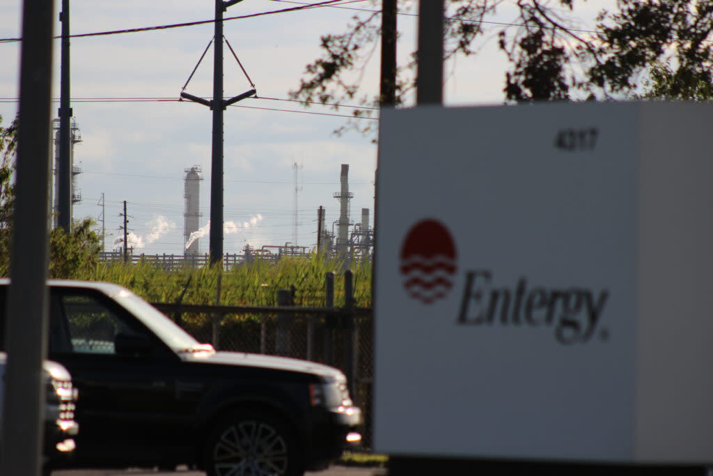 Entergy sign with power plant in distant background