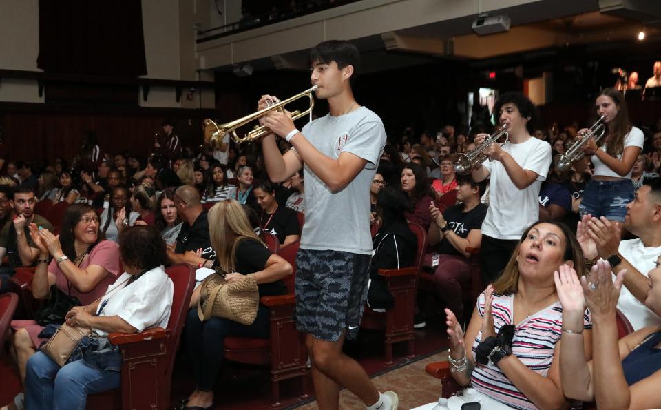 Junior Robert Kang, playing trumpet, leads bandmates down the aisle during the marching band's performance at the back to school staff assembly at Ossining High School Aug. 28, 2024. The Ossining High School's marching band has been invited to perform in the Pearl Harbor Memorial Parade in Hawaii on December 7, 2024.