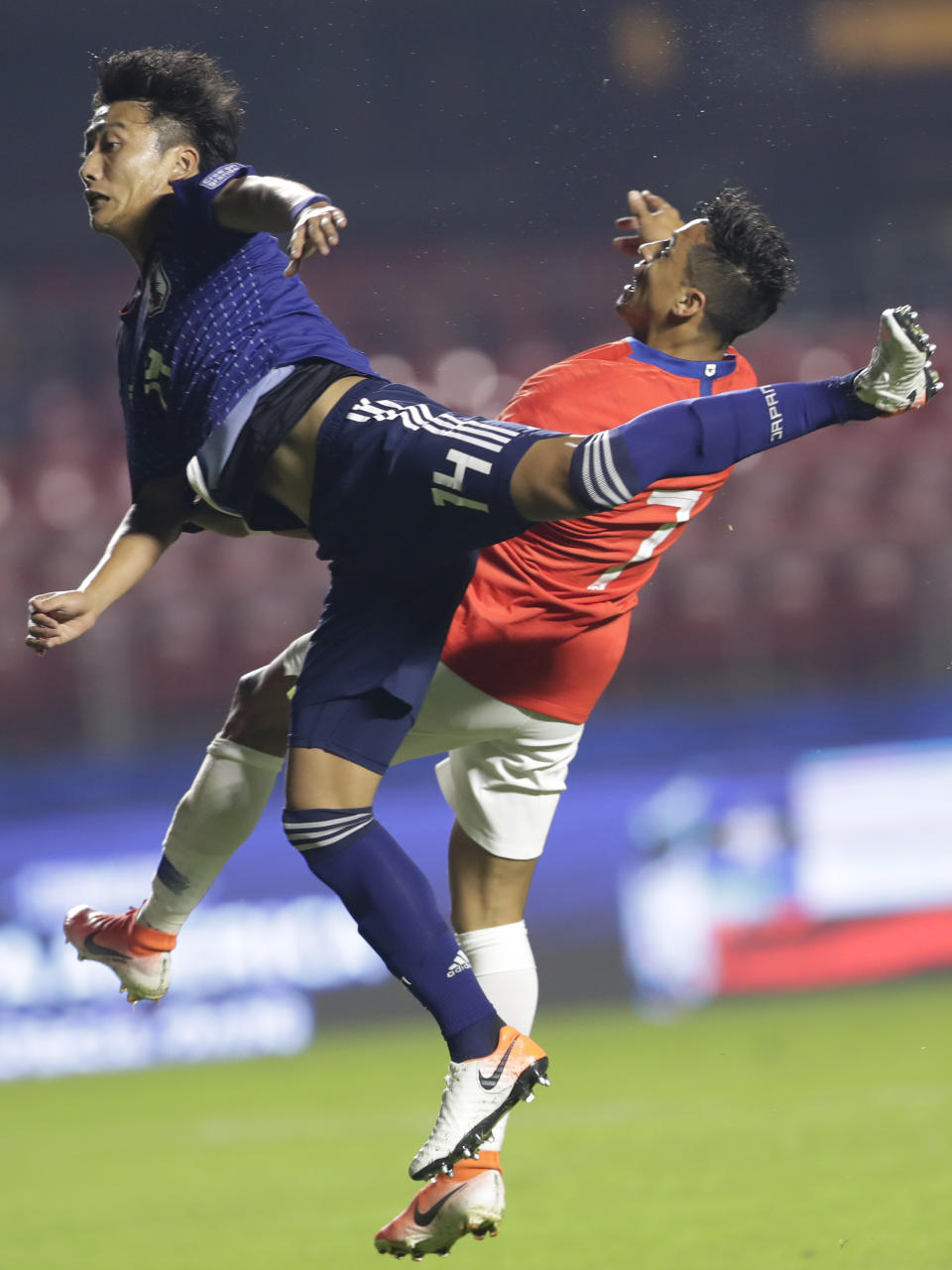 Japan's Teruki Hara, front, and Chile's Alexis Sanchez jump for the ball during a Copa America Group C soccer match at the Morumbi stadium in Sao Paulo, Brazil, Monday, June 17, 2019. (AP Photo/Andre Penner)