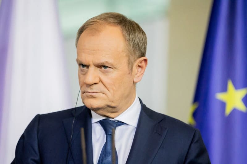 Polish Prime Minister Donald Tusk speaks during a press statement with German Chancellor Olaf Scholz and French President Emmanuel Macron (Not Pictured). Christoph Soeder/dpa