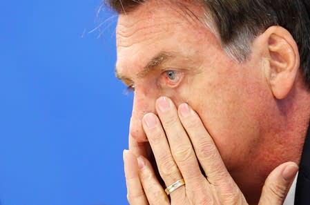 Brazil's President Jair Bolsonaro reacts during a news conference at the Planalto Palace in Brasilia