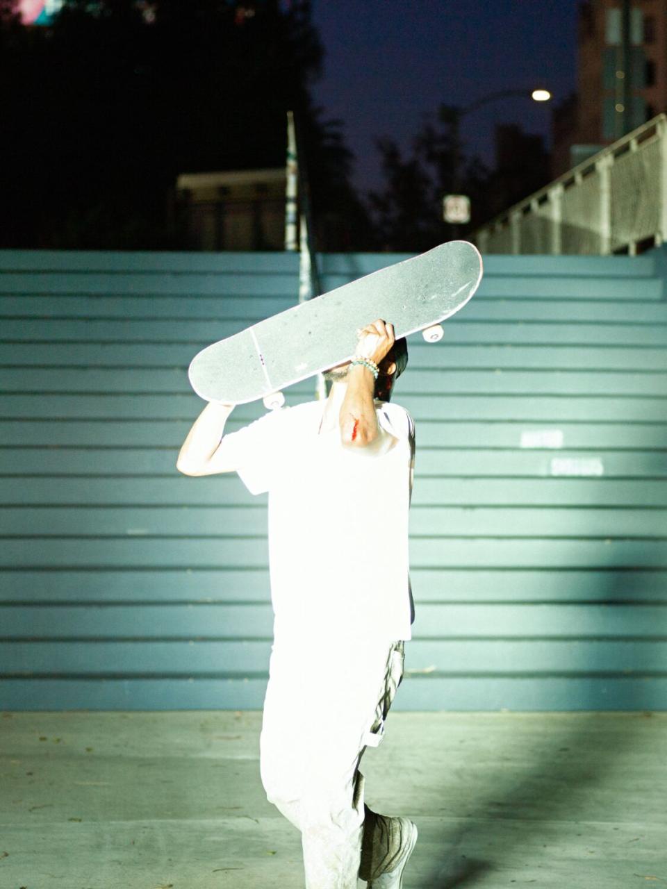 Domo Walker kisses his board.