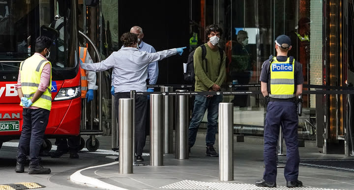 A security guard working in a Melbourne quarantine hotel was removed after slipping a note under a guest's door. Source: AAP