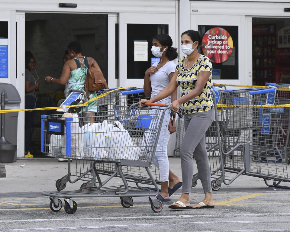 Shoppers at a Walmart in Coconut Creek, Florida, on Saturday as the chain's stores began limiting the number of customers inside. (Photo: mpi04/MediaPunch/IPx)