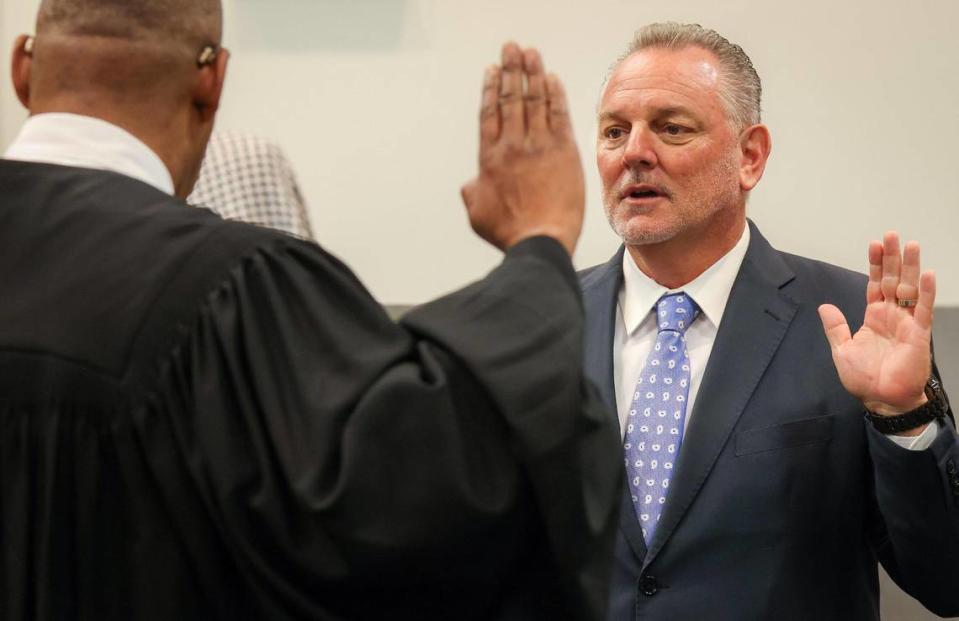 Judge Elijah H. Williams of the 7th Judicial Circuit, left, swears in Peter Licata, right, as the superintendent of Broward County Public Schools at the Kathleen C. Wright Administration Center’s boardroom in Fort Lauderdale, Florida, on Tuesday, July 18, 2023. Carl Juste/cjuste@miamiherald.com