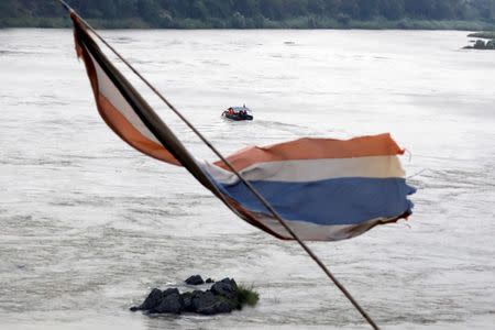 A Chinese boat, with a team of geologists, surveys the Mekong River at border between Laos and Thailand April 23, 2017. Picture taken April 23, 2017. REUTERS/Jorge Silva