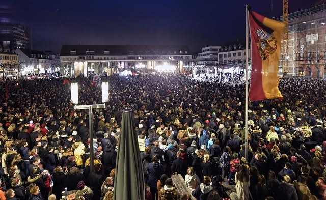 Thousands listen to German president Frank-Walter Steinmeier during a mourning on the marketplace for the victims of the shooting in Hanau, Germany