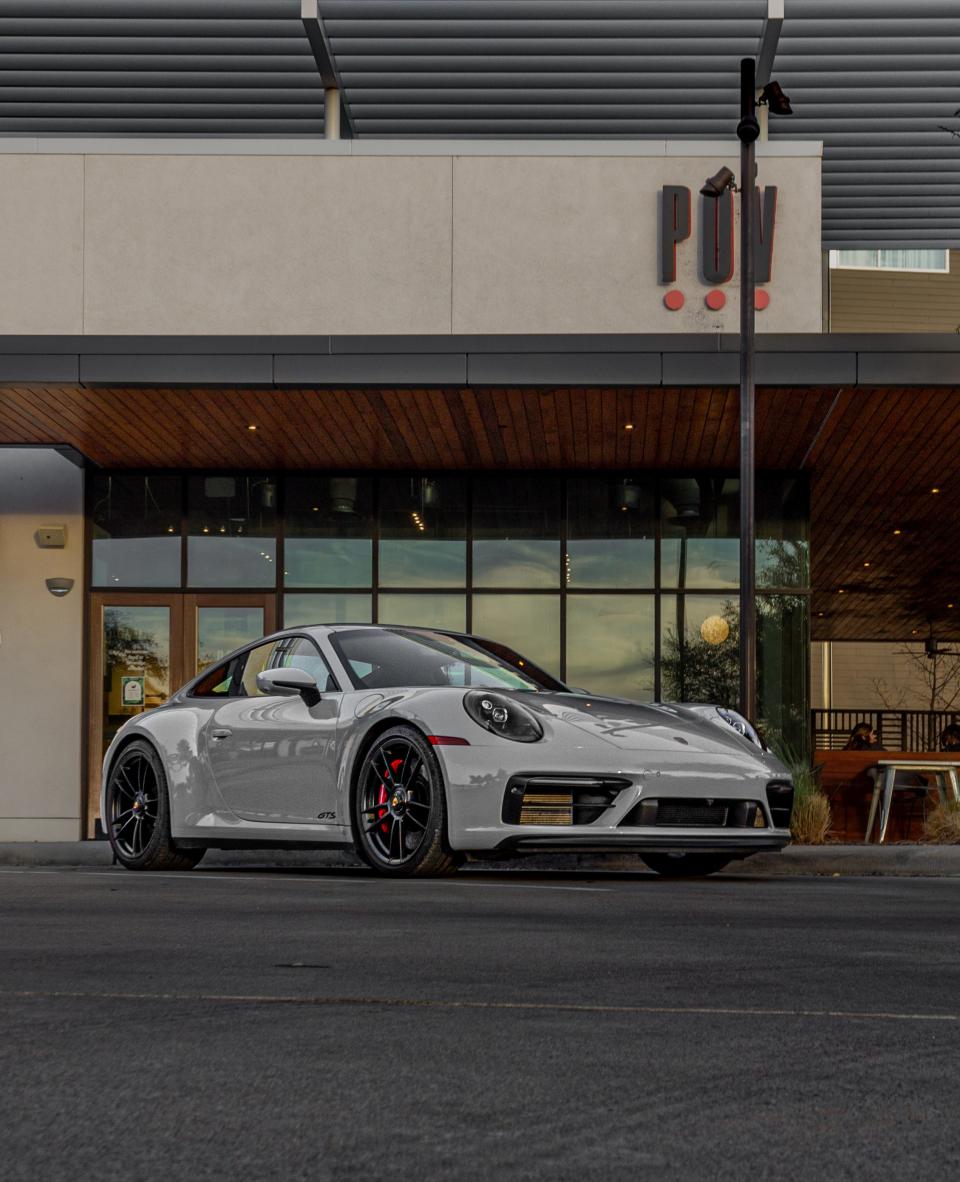 A gray Porsche 911 Carrera GTS.