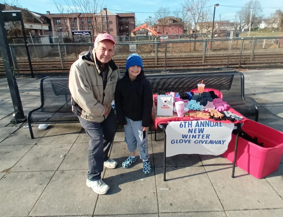 Asbury Park Mayor John Moor stopped at AJ DiLieto's glove giveaway in December.