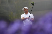 Bryson DeChambeau watches his tee shot on the 14th hole during a practice round for the U.S. Open Golf Championship Monday, June 14, 2021, at Torrey Pines Golf Course in San Diego. (AP Photo/Gregory Bull)