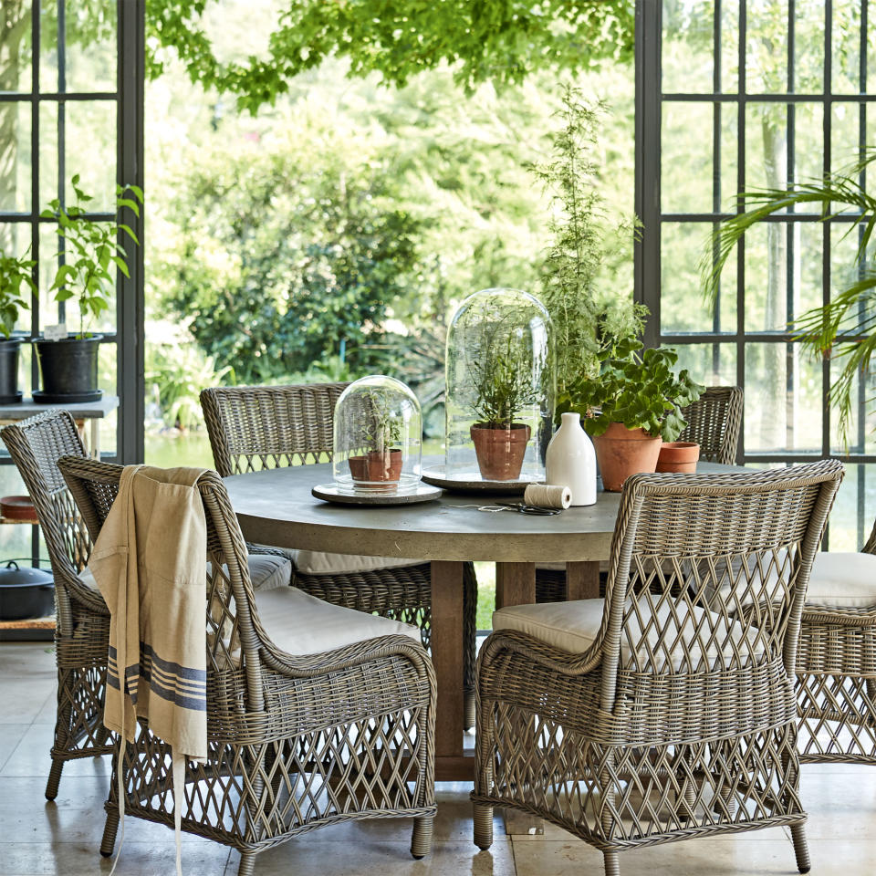 Conservatory with pendant light and wicker furniture