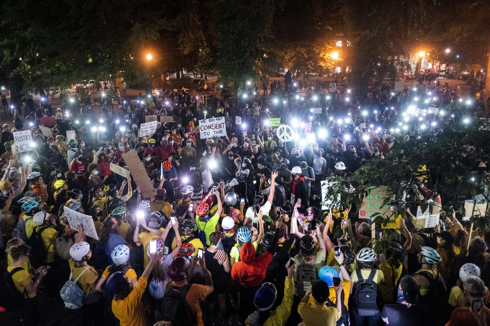 Hundreds of Black Lives Matter protesters rally near the Mark O. Hatfield United States Courthouse on Tuesday, July 21, 2020, in Portland, Ore. (AP Photo/Noah Berger)