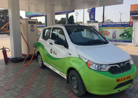 Mahindra's, e2oPlus, operated by Indian ride-hailing company Ola, is seen at an electric vehicle charging station in Nagpur, India January 24, 2018. REUTERS/Aditi Shah