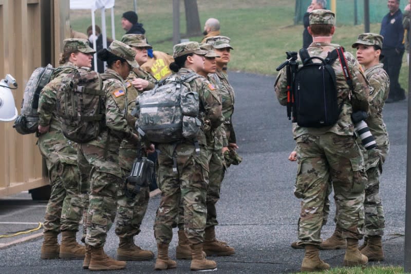 U.S. army soldiers arrive to cooperate at a new drive-thru coronavirus disease (COVID-19) testing center at Bergen Community College in Paramus, New Jersey