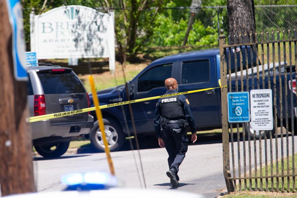 Memphis Police Department officers respond to an active scene after a police officer was shot while doing a warrant pickup at Breezy Point Apartments in Frayser on Wednesday, April 19, 2023.