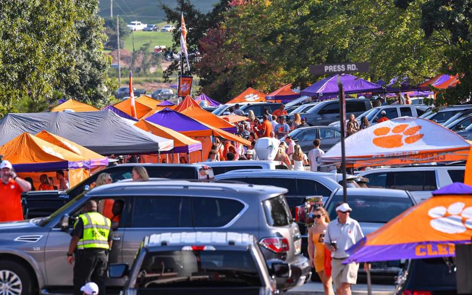 Sep 17, 2022; Clemson, South Carolina, USA; Clemson Tigers fans tailgate in parking areas before a game against the Louisiana Tech Bulldogs at Memorial Stadium. Mandatory Credit: Ken Ruinard-USA TODAY Sports