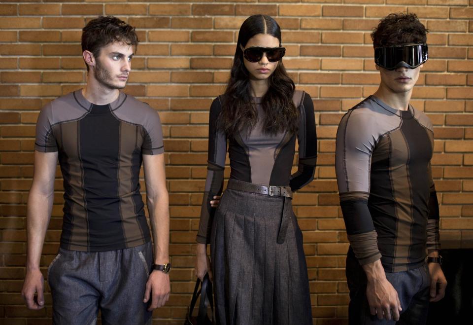 Models wait in line backstage before presenting creations from the Herchcovitch winter collection during Fashion Rio in Rio de Janeiro, Brazil, Friday, Nov. 8, 2013. (AP Photo/Felipe Dana)