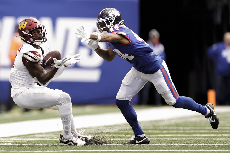 Washington Commanders wide receiver Terry McLaurin (17) can't make the catch as New York Giants cornerback Nick McCloud (44) applies pressure during the second quarter of an NFL football game, Sunday, Oct. 22, 2023, in East Rutherford, N.J. (AP Photo/Adam Hunger)