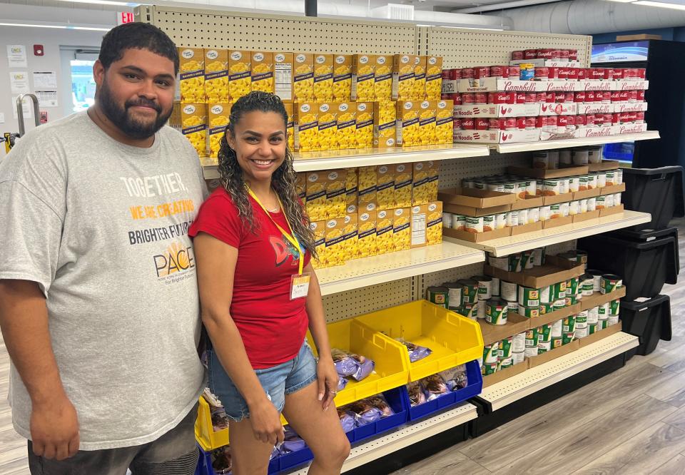 PACE's Luis Santiago and volunteer Shevona Pina take a break for a quick photo at PACE's new Community Food Center Wednesday.