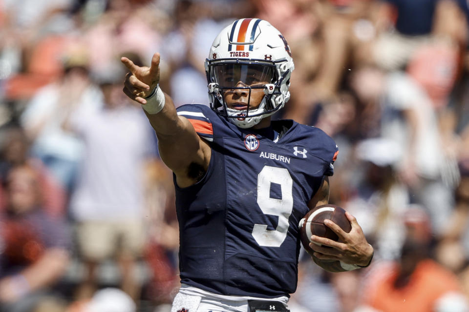 Auburn quarterback Robby Ashford reacts after making a first down during the first half of an NCAA college football game against Missouri, Saturday, Sept. 24, 2022 in Auburn, Ala. (AP Photo/Butch Dill)