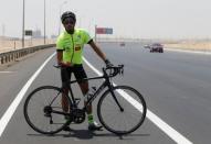 Egyptian cyclist Helmy El Saeed, 27, poses during training on the highway of El Ain El Sokhna, east of Cairo, Egypt July 19, 2017. REUTERS/Amr Abdallah Dalsh