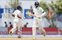 Cricket - Sri Lanka v India - First Test Match - Galle, Sri Lanka - July 27, 2017 - India's Ravichandran Ashwin and Wriddhiman Saha run between wickets. REUTERS/Dinuka Liyanawatte