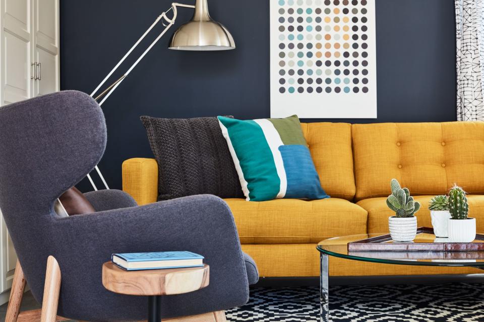 Brown was most reluctant about the colors Schuneman chose in the space, including the mustard sectional, and purple seating. "He was like 'Whoa'!" Laughs the designer. Brown admits though "when I saw it in the space, I was like, ‘Yo, this is kind of baller. I’m digging it.’”