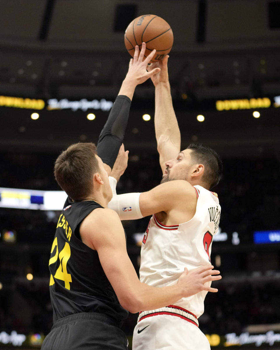 Utah Jazz's Walker Kessler (24) blocks the shot of Chicago Bulls' Nikola Vucevic during the first half of an NBA basketball game Monday, Nov. 6, 2023, in Chicago. (AP Photo/Charles Rex Arbogast)