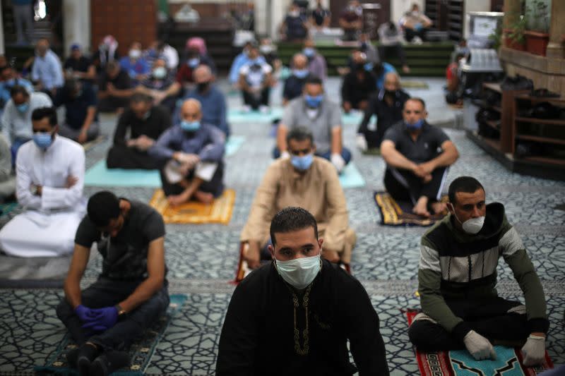 Muslims attend Friday prayers at al Husseini mosque in Amman