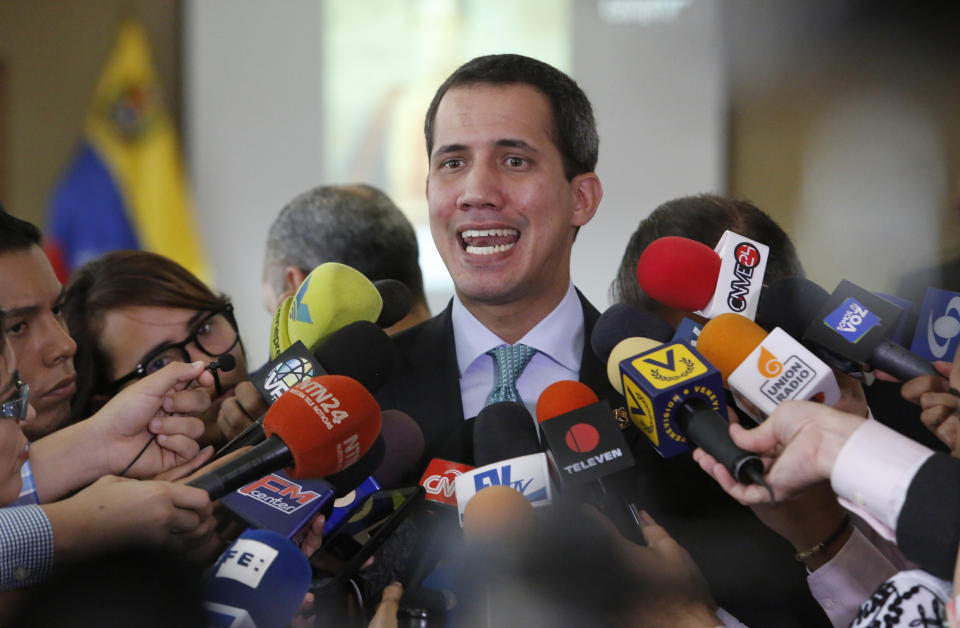 FILE - In this Sept. 3, 2019, file photo, Venezuela's opposition leader and self-proclaimed interim President of Venezuela, Juan Guaido, speaks to the press at the administrative headquarters of the National Assembly in Caracas, Venezuela. The Trump administration is more than tripling U.S. support for pro-democracy work in Venezuela and for the first time will give funds to Guaido as he attempts to set up an interim government. (AP Photo/Andrea Hernandez Briceño, File)